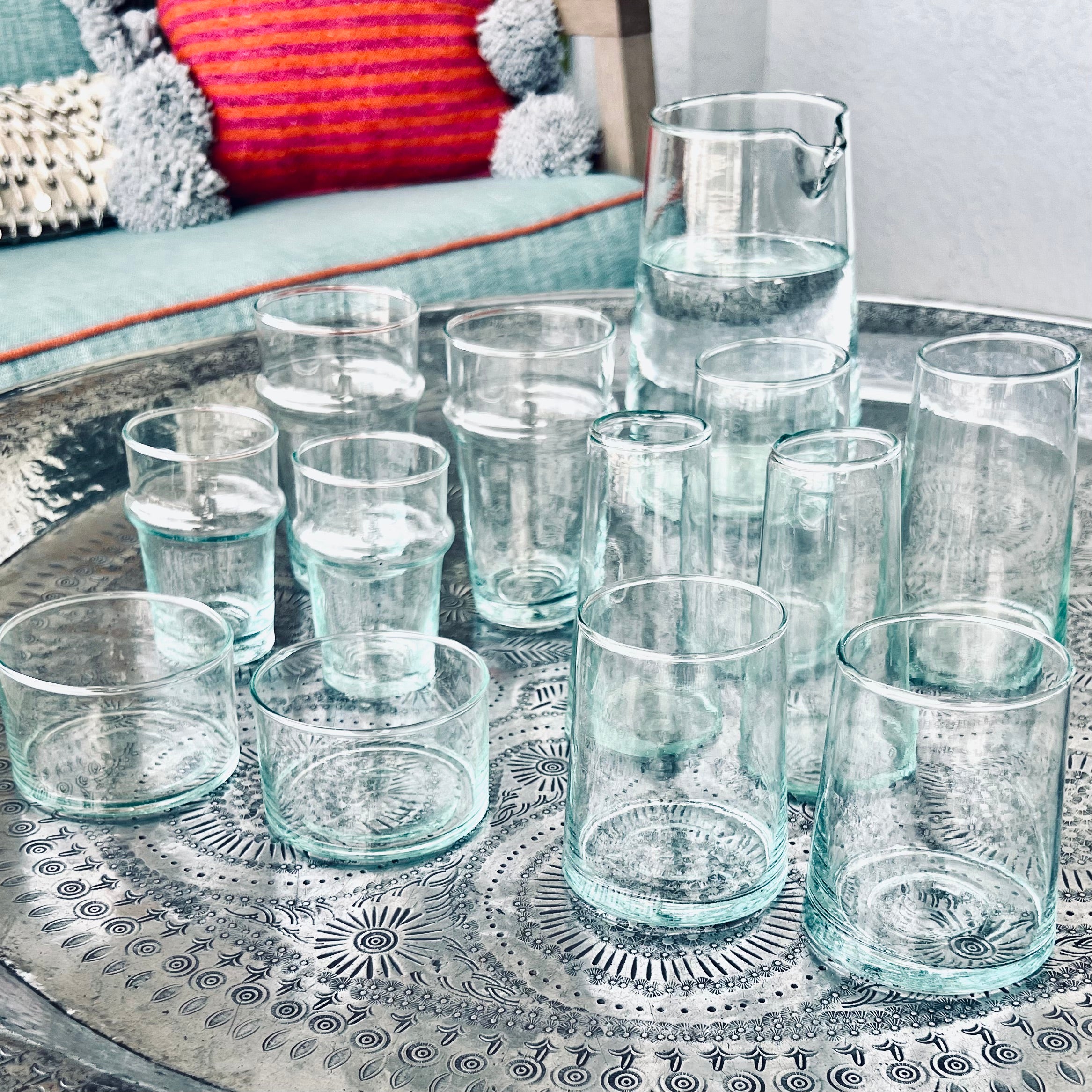 Beldi glasses catching the light on a Moroccan table